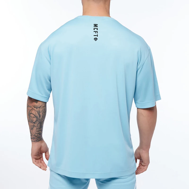 Сетчатые быстросохнущие футболки Оверсайз, мужские футболки с заниженным плечом и короткими рукавами, мужские летние свободные спортивные футболки для фитнеса в стиле хип-хоп.